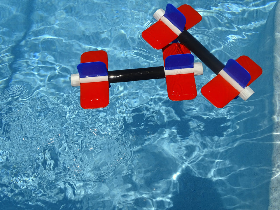 Pair of Aqua Bladez floating in pool water